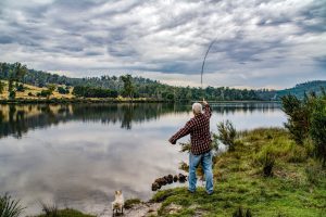 Person Fly Fishing on Lake