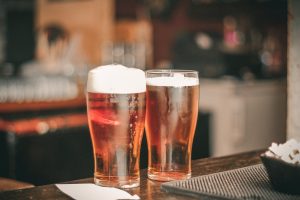 Two Glasses of Beer on Bar
