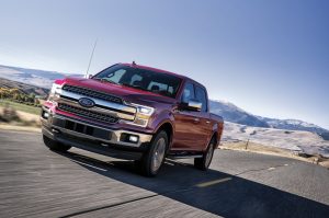 2020 Red Ford F-150 Driving Down Highway
