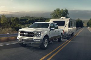White 2021 Ford F-150 Towing Camper