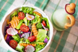 Close-Up of Salad with Carrots, Tomatoes, and Radishes
