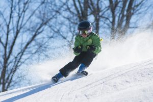 Boy Skiing Down a Hill