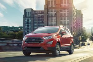 2021 Red EcoSport Driving Down Road